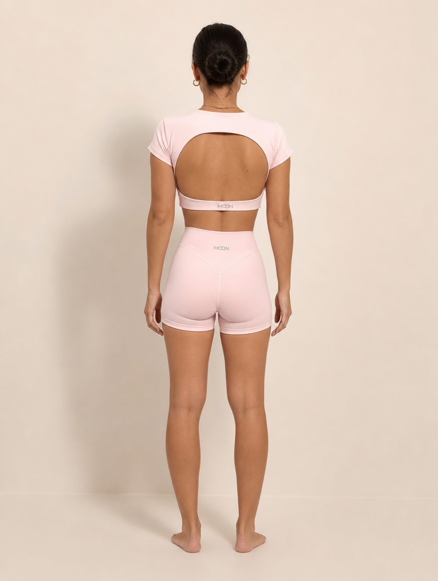 The Halo Set in Dawn Rose, back view showing the open circular back and the MOON band in soft pink.